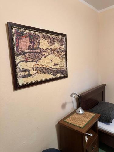 a picture hanging on the wall of a bedroom at Kerch Apartments in Radovići