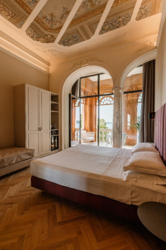 Ένα ή περισσότερα κρεβάτια σε δωμάτιο στο Hotel Monte Baldo e Villa Acquarone