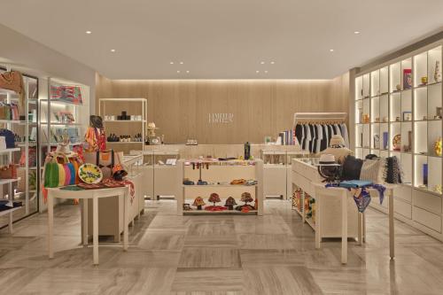 a store with many shelves and tables in a room at The Bodrum EDITION in Yalıkavak