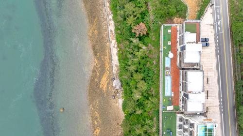 an aerial view of a beach and the water at Yeosu dasi bom pension in Yeosu