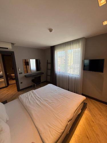 Postel nebo postele na pokoji v ubytování Z-Suites