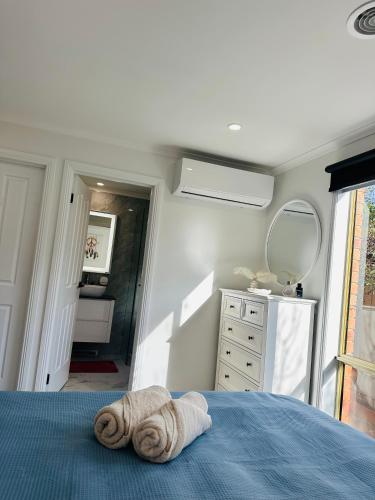 a bedroom with a bed with a towel on it at 3 bedroom House in Hampton Park in Hampton Park