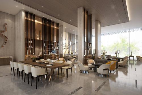 a dining room with a table and chairs at Courtyard by Marriott North Pattaya in Pattaya North