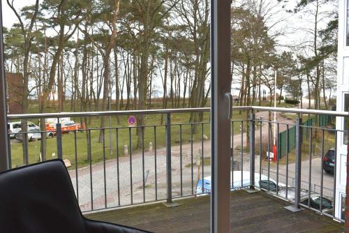 a balcony with a view of a street with a fire truck at Seepassage Ferienwohnung Nr 02 in Timmendorfer Strand