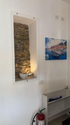 a wall with a niche with a stone wall at La Casetta di Riccardo - Terrace Sea View in Portovenere