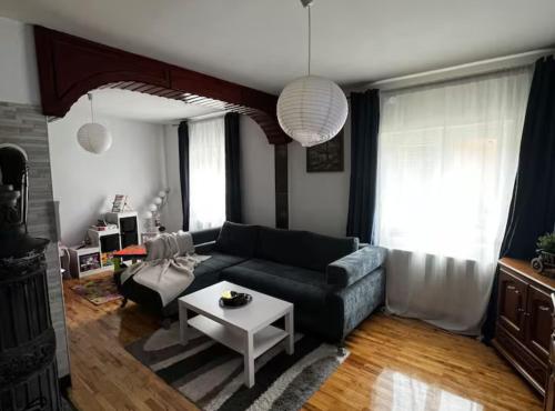 a living room with a couch and a table at House Burić in Senj