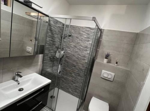 a bathroom with a shower and a sink at House Burić in Senj