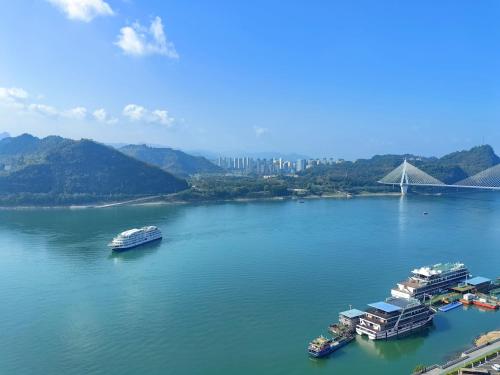 an aerial view of a large river with boats at Crowne Plaza Yichang by IHG in Yichang