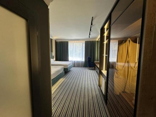 Postel nebo postele na pokoji v ubytování Sapar Standart Hotel