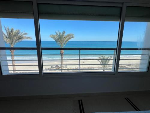 a view of the beach from a window at Mahdia front sea balcony 2 in Hiboun
