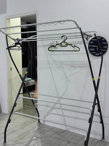 a glass display case with a clock on it at Zen 66 apartment in Kuching