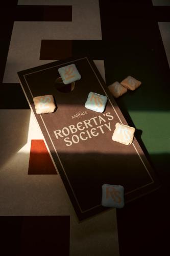a chocolate cake with the words recovery society on it at Roberta's Society Aarhus in Aarhus