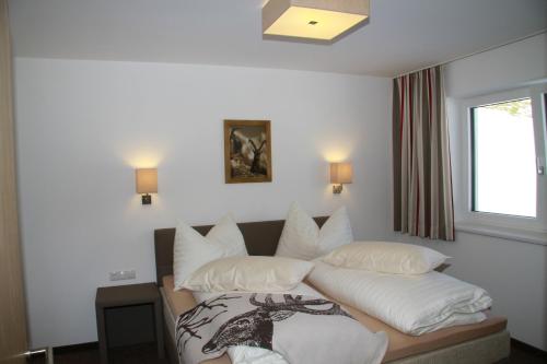 Cama o camas de una habitación en Apart Alpin