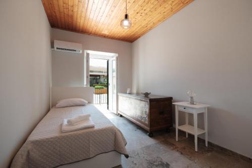 Postel nebo postele na pokoji v ubytování Casa Tilemachos Perithia