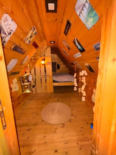 a room in a tree house with a bed in it at Gite Clé des Champs in Montenois