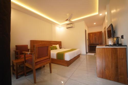 Postel nebo postele na pokoji v ubytování Zeezmount Resorts & Spa Munnar
