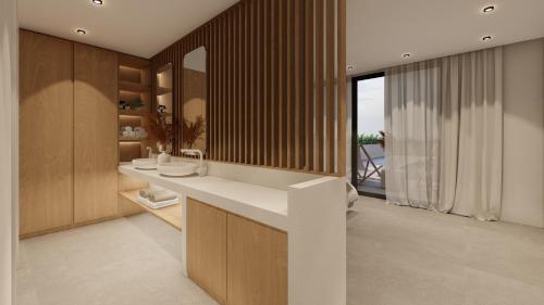 Linea Verde Villa Exclusive by Sealand Villas في تسيليفي: حمام مع طاولة بيضاء ونافذة كبيرة