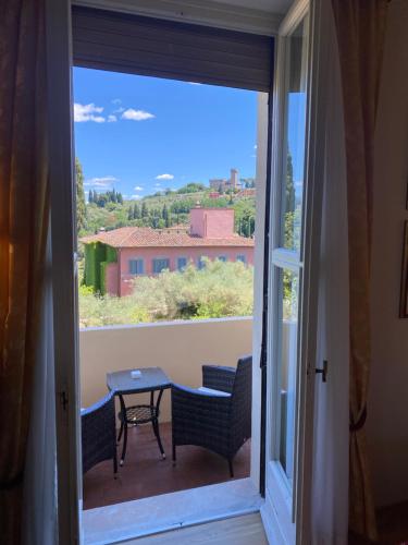 a view from a balcony with a table and chairs at Park Palace Hotel in Florence