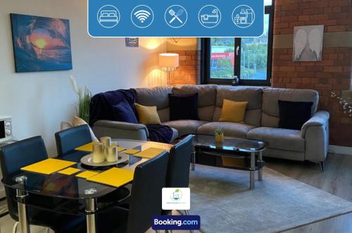 a living room with a couch and a table at Two Bedroom Apartment In Bradford Canal Road Contractors With Free WiFi in Bradford