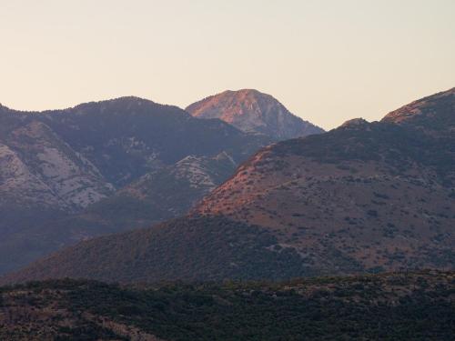 a group of mountains with trees in the foreground at Castor & Pollux in Kotrónion