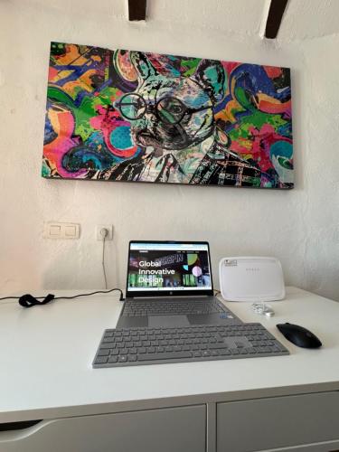 a laptop computer sitting on top of a desk at Cueva Solaz Galera in Galera