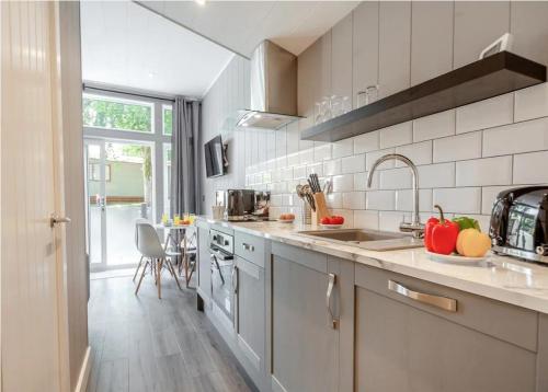 a kitchen with a sink and a counter top at V28 - The Lookout with Hot Tub in Bethesda