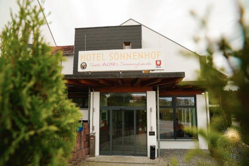 a building with a sign that reads hotel someneroff at Hotel Sonnenhof - Tante ALMA`s Sommerfrische in Sonnen