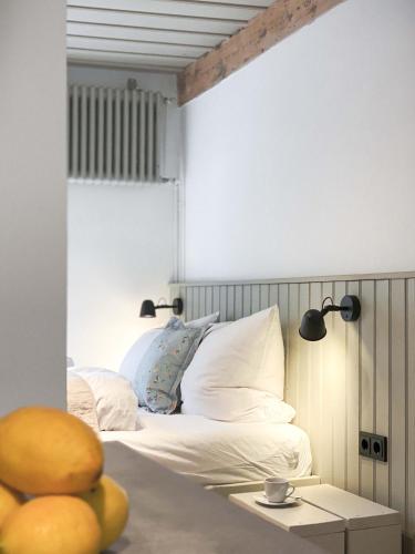 a bedroom with a bed and a table with a cup on it at Ferienwohnung 2, Schlaf-Gut-Johannis, Flensburg in Flensburg
