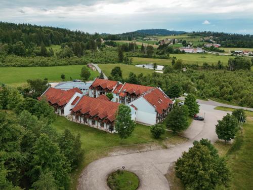 an aerial view of a house with red roofs at Hotel Sonnenhof - Tante ALMA`s Sommerfrische in Sonnen