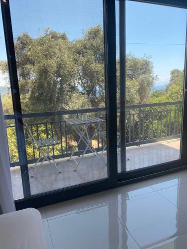 a view from a window of a balcony at MeTime3 in Parga