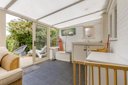 a kitchen with a patio with a table at 3 Bed in Baconsthorpe oc-s32338 in Baconsthorpe