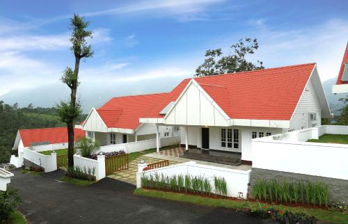 a row of houses with red roofs at The Fog Munnar (Resort & Spa) in Munnar
