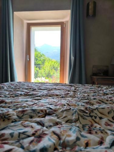 Postel nebo postele na pokoji v ubytování La Terrazza di Rivoria