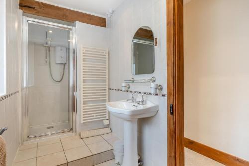 a bathroom with a sink and a shower at 2 Bed in Sharrington oc-h32406 in Sharrington