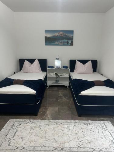 Postel nebo postele na pokoji v ubytování Apartmani M&DŽ Bihać