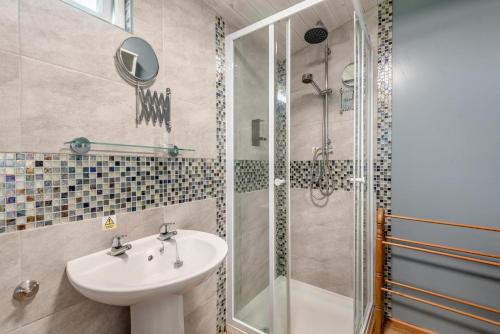 a bathroom with a sink and a shower at 2 Bed in Keddington oc-t32411 in Louth