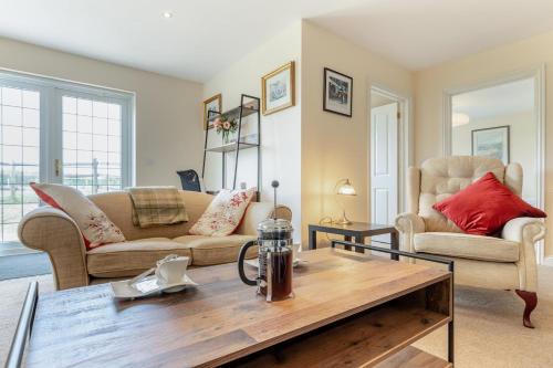 a living room with two couches and a coffee table at 1 Bed in Flore oc-b32437 in Flore
