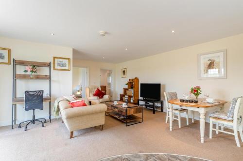 a living room with a couch and a table at 1 Bed in Flore oc-b32437 in Flore