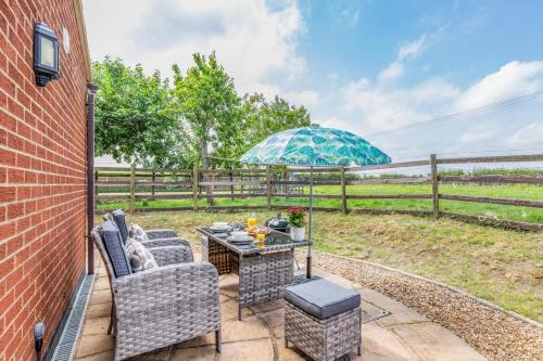 a patio with a table and chairs and a fence at 1 Bed in Flore oc-b32437 in Flore