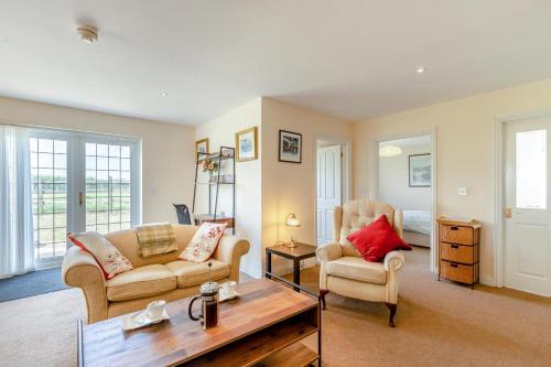 a living room with two couches and a coffee table at 1 Bed in Flore oc-b32437 in Flore