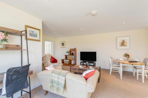 a living room with a couch and a table at 1 Bed in Flore oc-b32437 in Flore
