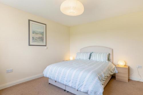 a bedroom with a bed and a picture on the wall at 1 Bed in Flore oc-b32437 in Flore