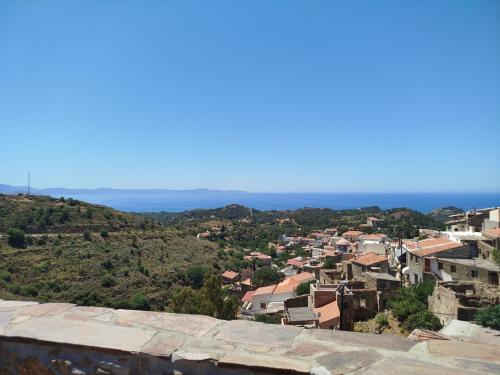 a view of a city from a hill at Volissos Sea View Maisonettes in Volissos