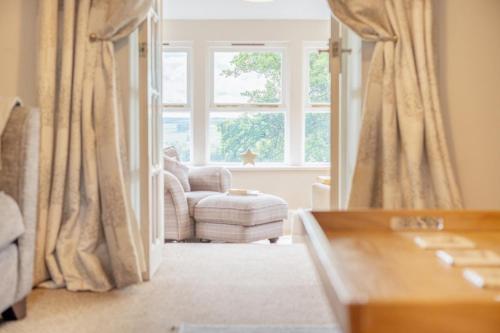 a living room with a chair and a window at 2 Bed in Methven oc-c32362 in Methven
