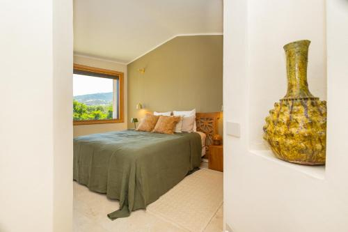 Katil atau katil-katil dalam bilik di Luxury Villa in Cala dei Ginepri