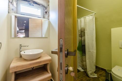 a bathroom with a sink and a shower at Fantastic Seafront Villa 4 Bedrooms Villa Samostan Prestige Stunning Sea Views & Enclosed Garden With Private Pool Korcula in Korčula