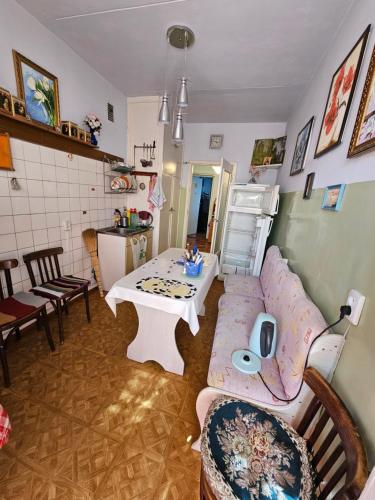 a living room with a couch and a table at Иссык-Куль, Аврора in Bulan Sogottuu