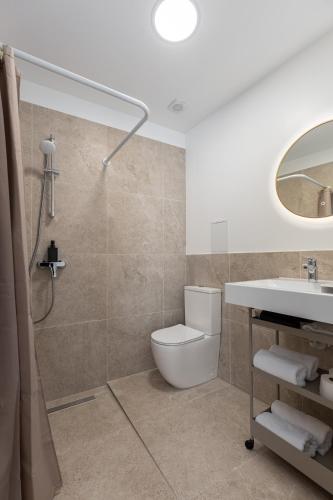 a bathroom with a toilet and a sink at P6-A Riga Old Town Apartments in Rīga