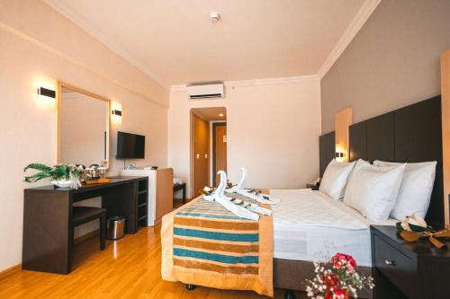 Ένα ή περισσότερα κρεβάτια σε δωμάτιο στο Viking Garden Hotel