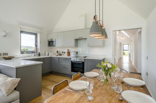 a kitchen and dining room with a table and chairs at 2 Bed in Newburgh oc-g32594 in Newburgh